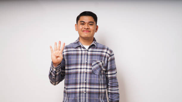 istock Young Asian man showing one fingers sign 1864291196