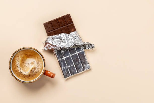 istock Coffee break bliss: Chocolate bar paired with a cup of coffee 1864306992