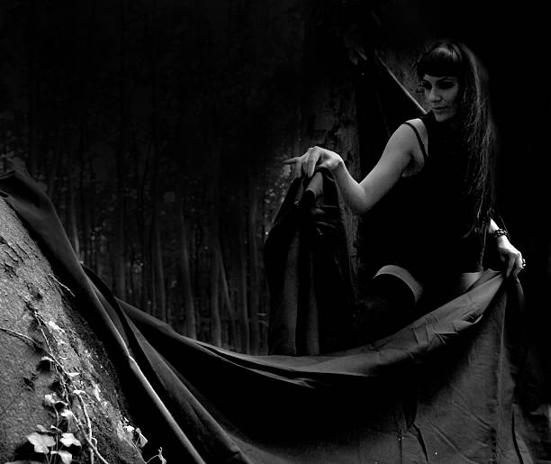 istock women in dark forest 186435064