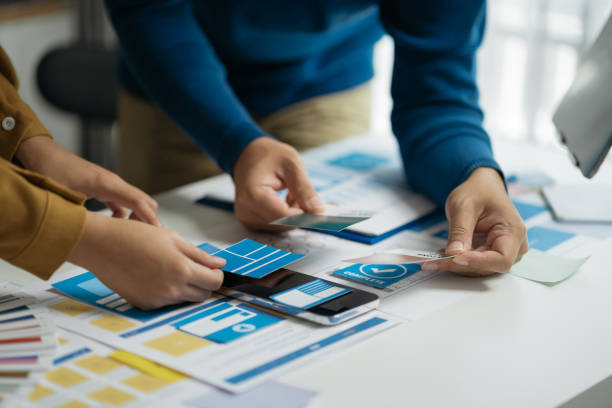 istock designer team shake hands confidently professional investor working with new startup project at an office meeting. 1864356251