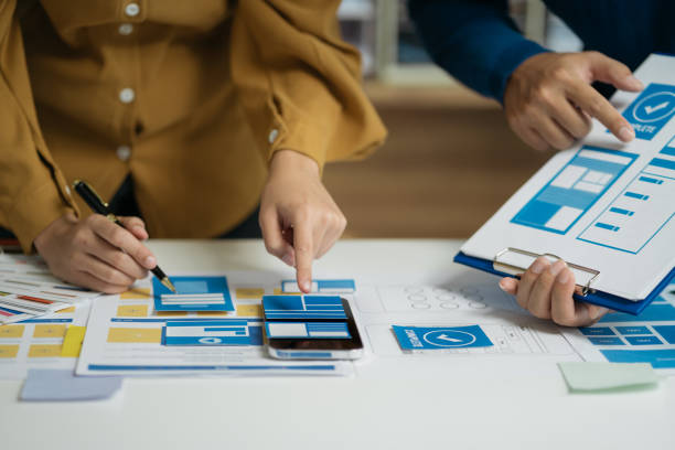 istock designer team shake hands confidently professional investor working with new startup project at an office meeting. 1864356257