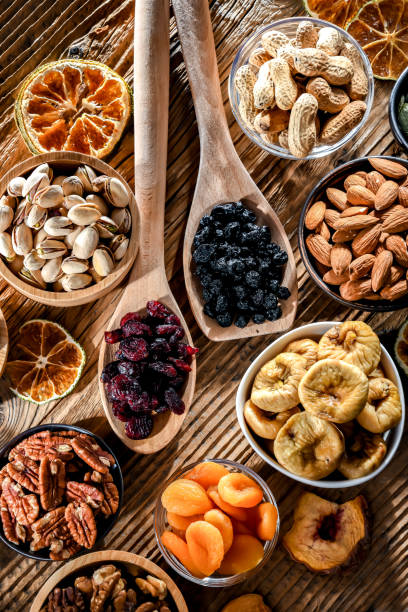 istock Composition with a variety of dried fruits and assorted nuts. 1864360467