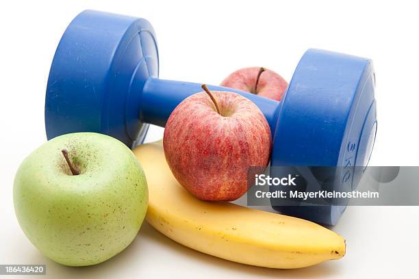 Apples And Banana With Dumbbell Stock Photo - Download Image Now - Apple - Fruit, Banana, Blue