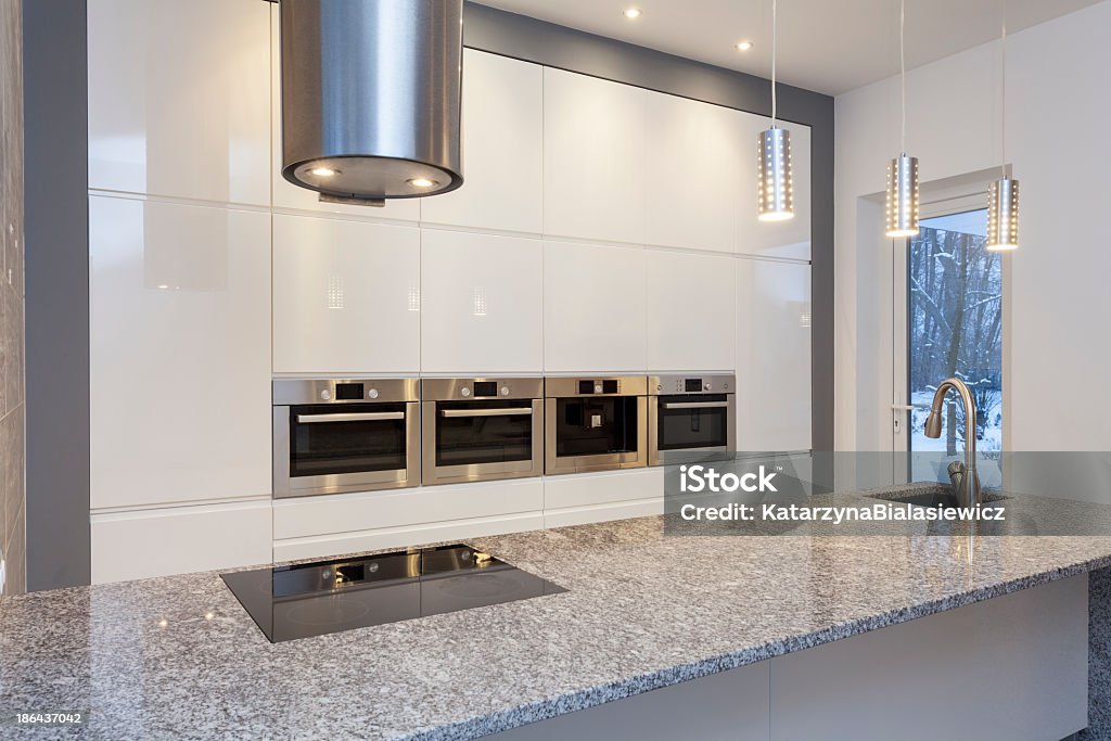 Designers interior - kitchen Designers interior - kitchen with white shelves Granite - Rock Stock Photo