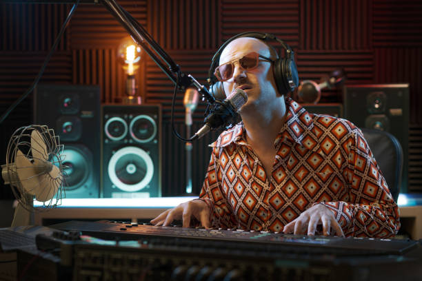 istock Musician singing and playing in the recording studio 1864375103