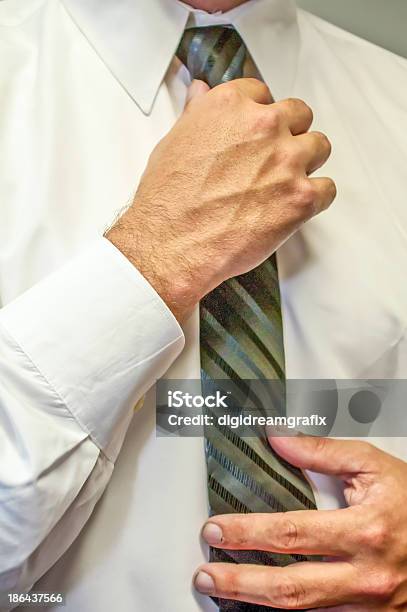 Man Fixing A Tie With Hands Stock Photo - Download Image Now - Adult, Adults Only, Authority