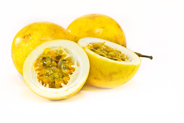 Passion fruit in both whole and cut in half  stock photo