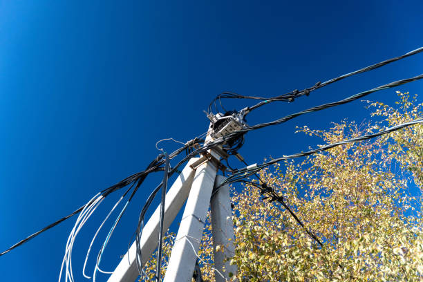 istock Tall Concrete Pillar Supporting Electrical Power Supply Wires 1864379313