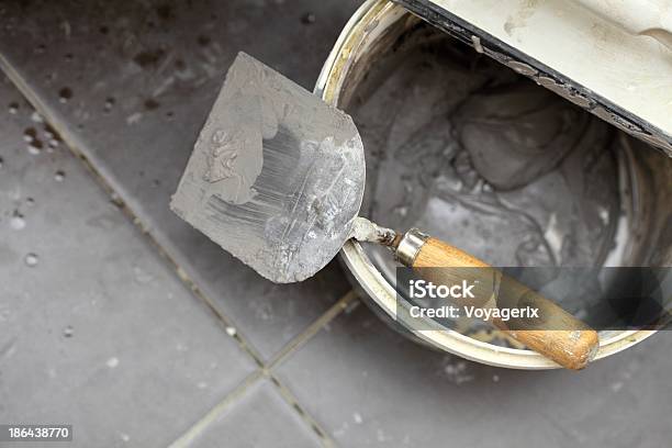 Dirty Trowel And Bucket On Building Site Renovation At Home Stock Photo - Download Image Now
