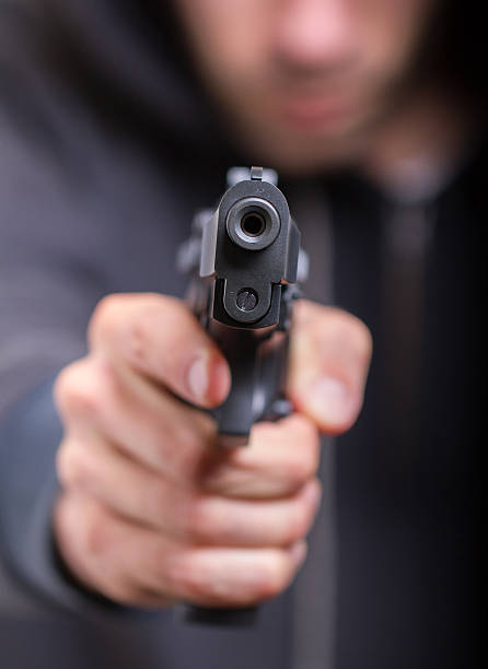 istock Man with gun, gangster 186439928