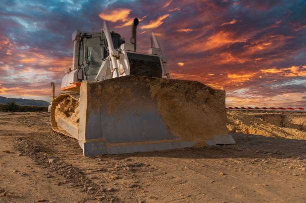 istock Excavator building a road in a site construction 1864413137
