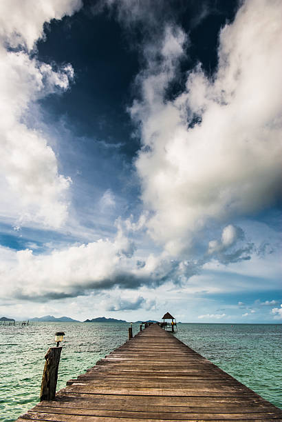 istock Wooden bridge extending into the sea 186441616