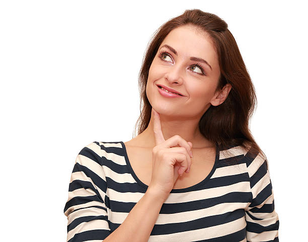 istock Beautiful smiling woman looking up with thinking eyes 186441704