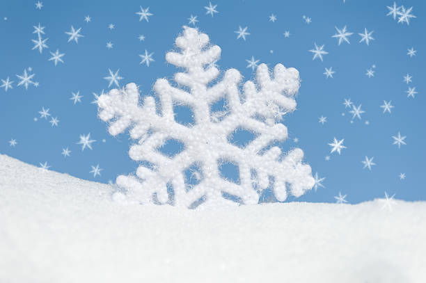 istock big snowflake in snow on sky background 186444188