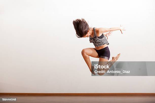 Jazz Dancer Performing A Jump Stock Photo - Download Image Now - Jazz Music, 20-29 Years, Activity
