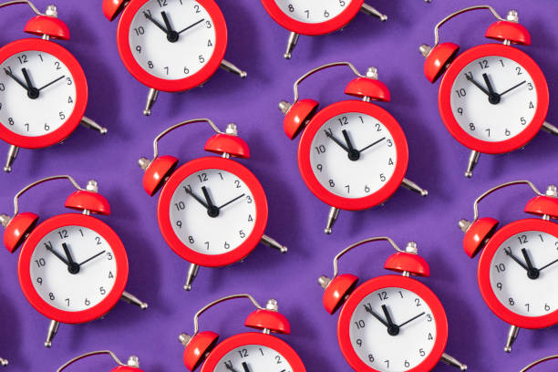 istock Alarm Clock on Purple Background 1864446855
