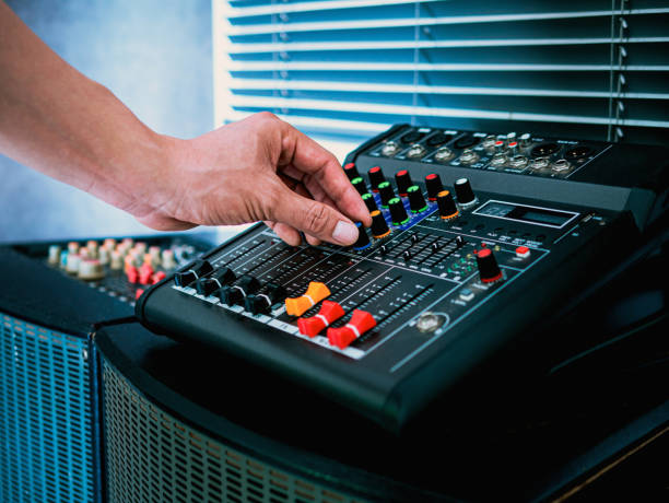 sound engineer hands adjusting control sound mixer in recording, broadcasting studio,sound mixer. professional audio mixing console, buttons, faders and sliders. sound check. - recording studio sound recording equipment record interconnect imagens e fotografias de stock