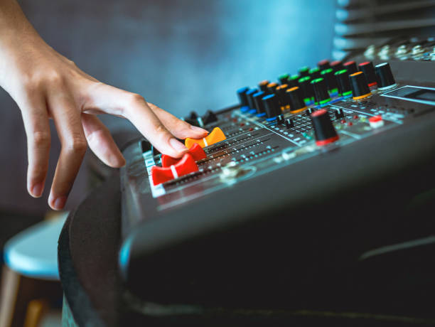 sound engineer hands adjusting control sound mixer in recording, broadcasting studio,sound mixer. professional audio mixing console, buttons, faders and sliders. sound check. - recording studio sound recording equipment record interconnect imagens e fotografias de stock