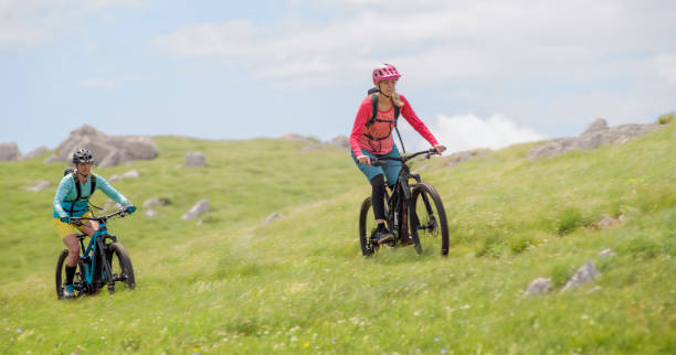 istock Mature women riding  electric bicycle 1864506525