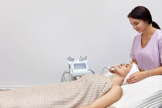 istock cosmetologist doing anti aging procedure in salon 1864508712