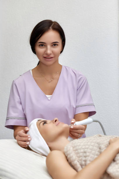 istock cosmetologist doing anti aging procedure in salon 1864508719