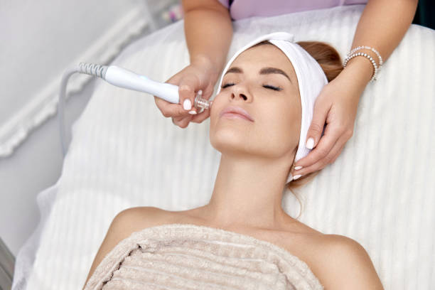 istock cosmetologist doing anti aging procedure in salon 1864508954