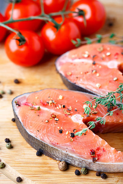 istock Salmon steak with thyme and pepper 186451340
