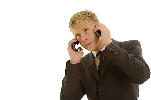 Businessman calls at two mobilephones