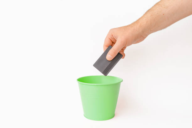 istock The credit card is thrown into the trash basket.White background,selective focus,copy space. 1864524821