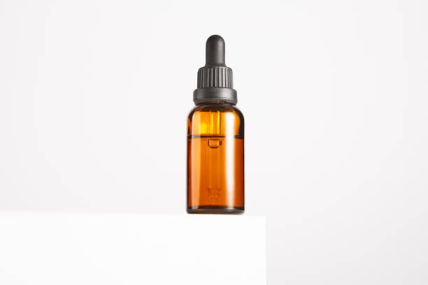 istock Brown glass container with pipette for cosmetic product. 1864527545