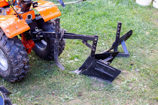 istock Plow and hiller complete with a walk-behind tractor for agricultural work. 1864530757