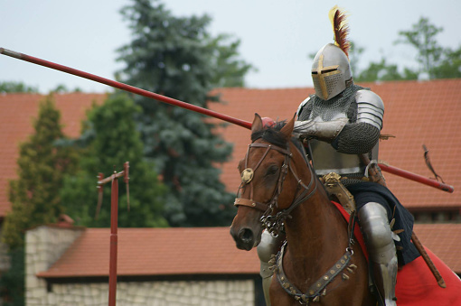 A demonstration of riding and drill of Polish uhlans from 1939, performed by a squadron of a historical reconstruction group. Knight on horseback in armor.