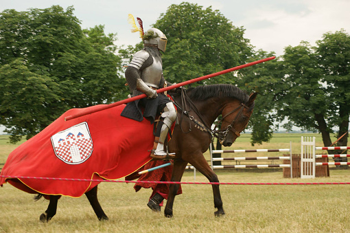 A demonstration of riding and drill of Polish uhlans from 1939, performed by a squadron of a historical reconstruction group. Knight on horseback in armor.