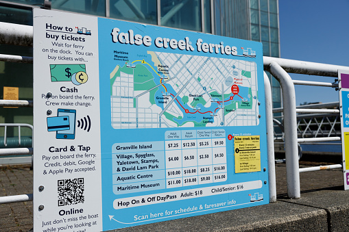 Vancouver, Canada - July 1,2023: View of False Creek Ferries schedule with prices