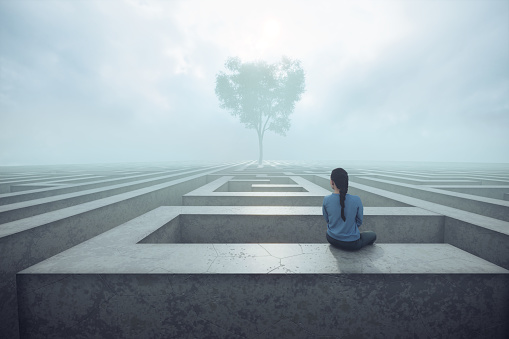 Young woman sitting on maze and looking to the distant tree. (3d render)