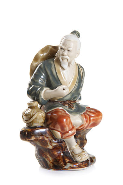 porcelain figurine of an old man isolated on white background