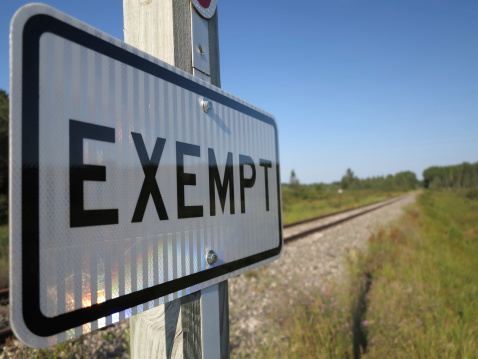 Sign indicating exempt railroad tracks.