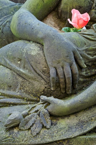 Mourning statue of Mother and child - detail - old cemetery at Krasna Lipa, Czech republic, Europe