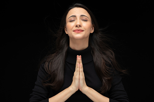 Photo of beautiful amazed girl wearing casual black t-shirt isolated black background