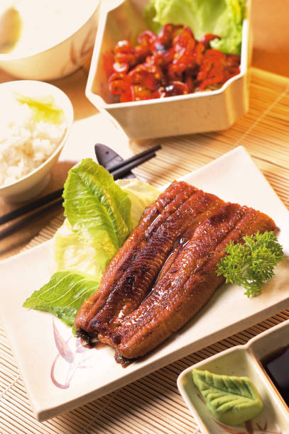 istock Japanese style grilled eel with soy based sauce or unagi kabayaki set 1864656610