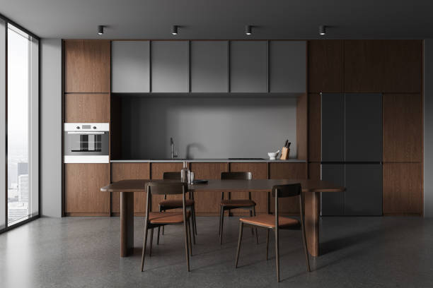 istock Dark home kitchen interior with eating and cooking space, panoramic window 1864667015