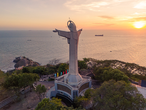 Aerial view of Vung Tau city, Vietnam, panoramic view of the peaceful and beautiful coastal city behind the statue of Christ the King standing on Mount Nho in Vung Tau city. Travel and landscape concept