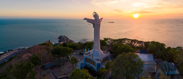 Aerial view of Vung Tau city, Vietnam, panoramic view of the peaceful and beautiful coastal city behind the statue of Christ the King standing on Mount Nho in Vung Tau city. Travel and landscape concept