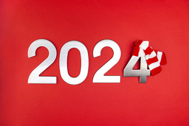 istock Composition with the number 2024 in silver, metal on a red monochrome background 1864683742