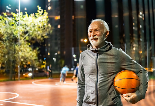 Basketball player standing on the sports court