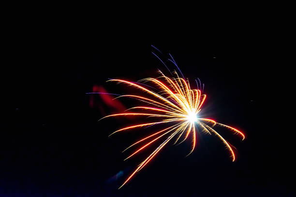 istock Bright flashes of fireworks in the night sky. 1864693161