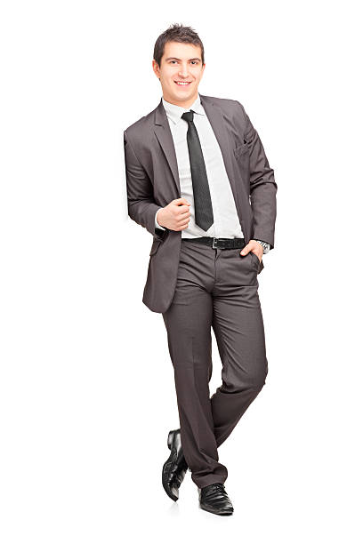 istock Smiling male businessman leaning against wall 186469586