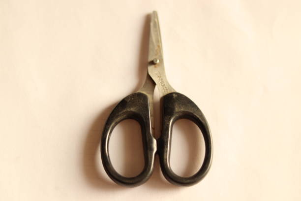 istock A small black stainless steel scissor with black handle 1864705135