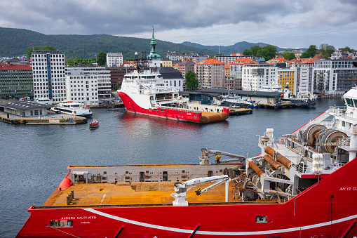 Bergen, Norway, June 29, 2023: The Bergen Port, pictured here in summer,  is an international seaport shared by commerical and recreational boats and is conists of  two bays, Vagen and Puddefjorden.