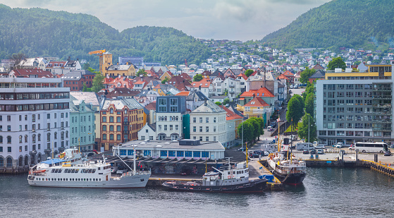 Bergen, Norway, June 29, 2023: The Bergen Port, pictured here in summer,  is an international seaport shared by commerical and recreational boats and is conists of  two bays, Vagen and Puddefjorden.